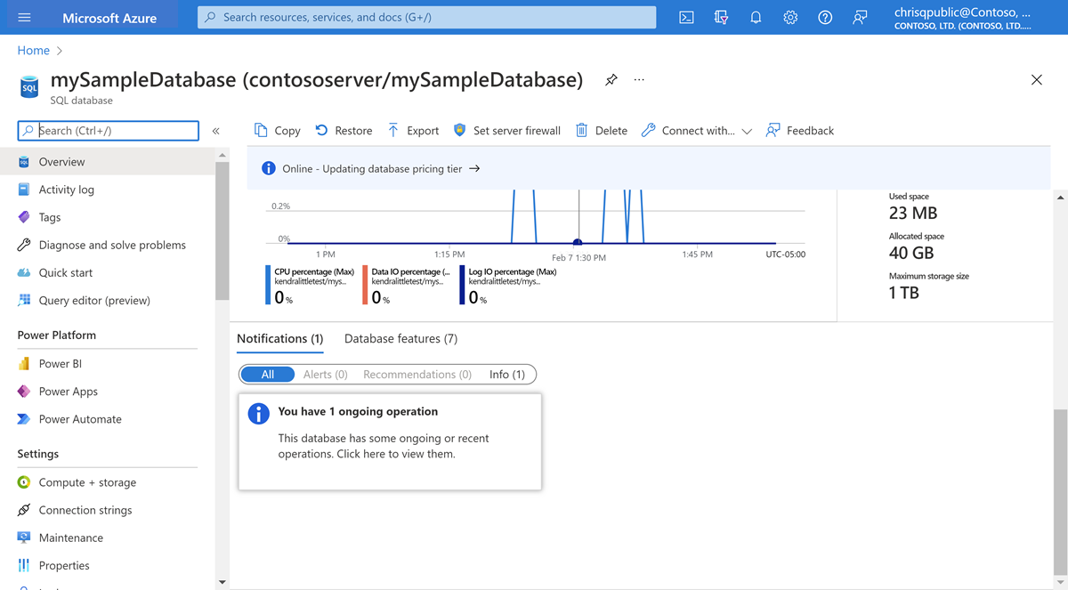 Screenshot of the overview panel of a database in Azure SQL Database. A notification of an ongoing operation appears in the notification area at the bottom of the panel.