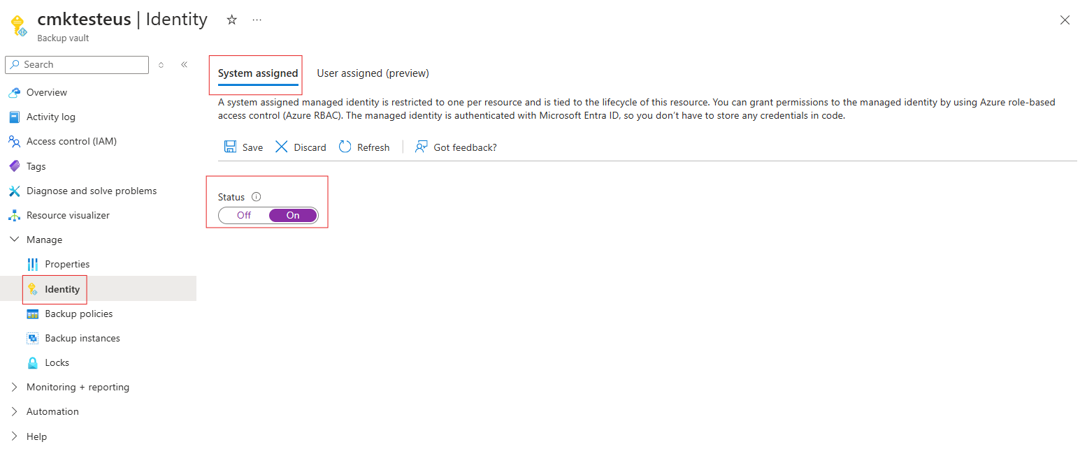 Screenshot shows the addition of system-assigned managed identity to the vault.